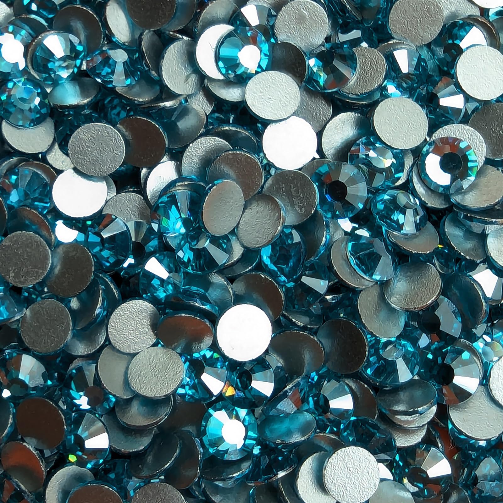 Genie Crystal embellishment on tumblers and clothing with Ice Aquamarine stones.