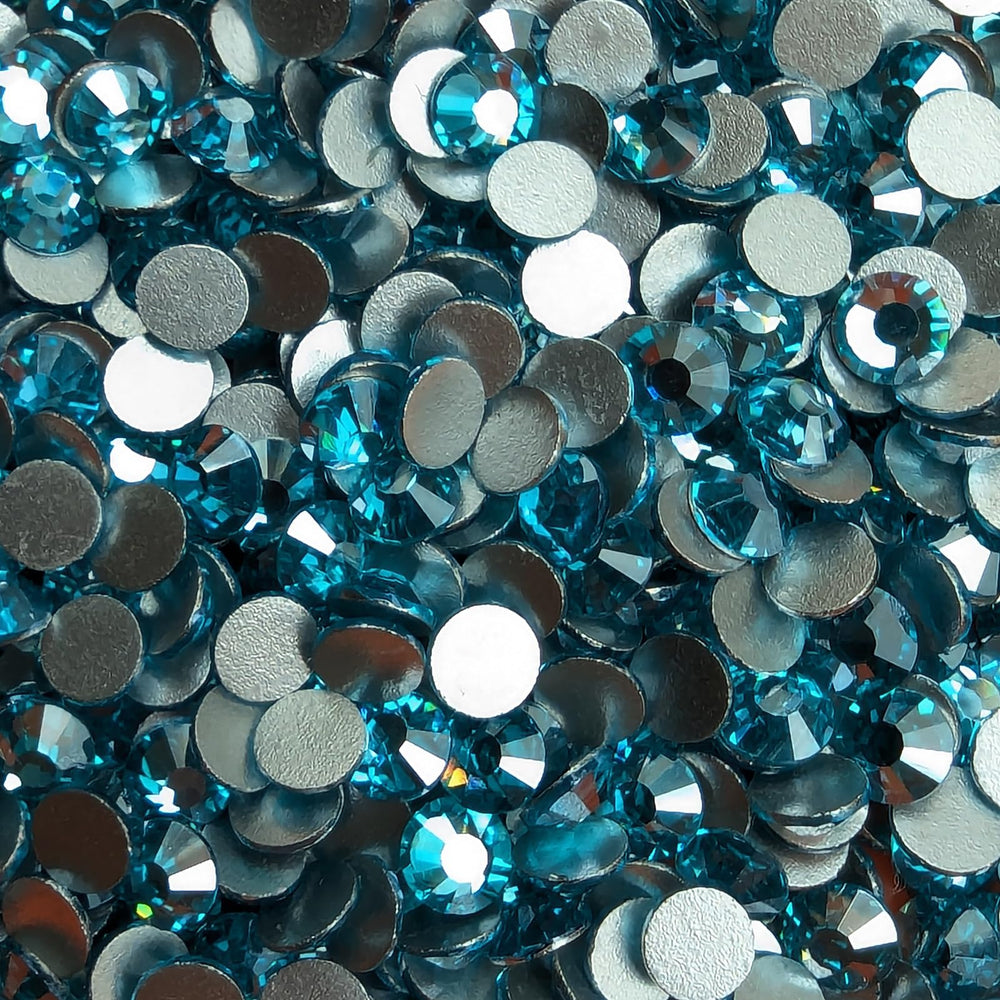 Genie Crystal embellishment on tumblers and clothing with Ice Aquamarine stones.