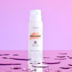 Georgiemane Curl Cream on model's curls showing moisture.