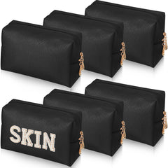 Gerrii Preppy Patch makeup bag in black with zipper for secure storage.