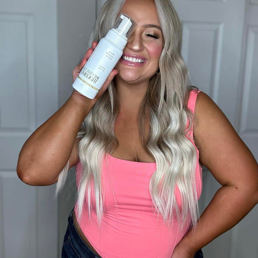 Get Into The Limelight 2 Hour Ultra Dark Mousse face application closeup shows even coverage.