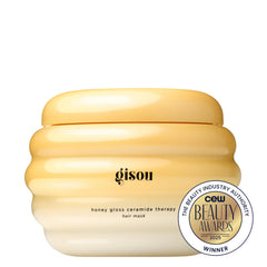 Gisou Honey Gloss Ceramide Therapy Hair Mask Mini applied on hair demonstrates nourishment and frizz control