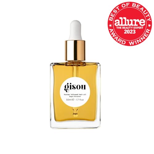 Gisou Honey Infused Hair Oil being applied for instant shine.