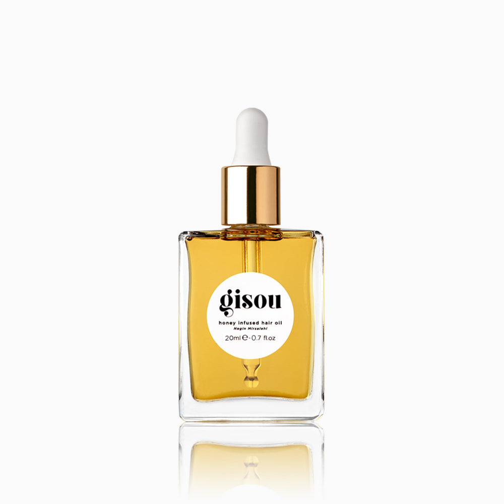 Gisou Honey Infused Hair Oil Mini bottle showing luxe hydration for healthier-looking hair.