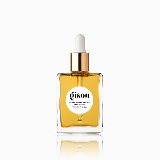 Gisou Honey Infused Hair Oil Mini bottle showing luxe hydration for healthier-looking hair.