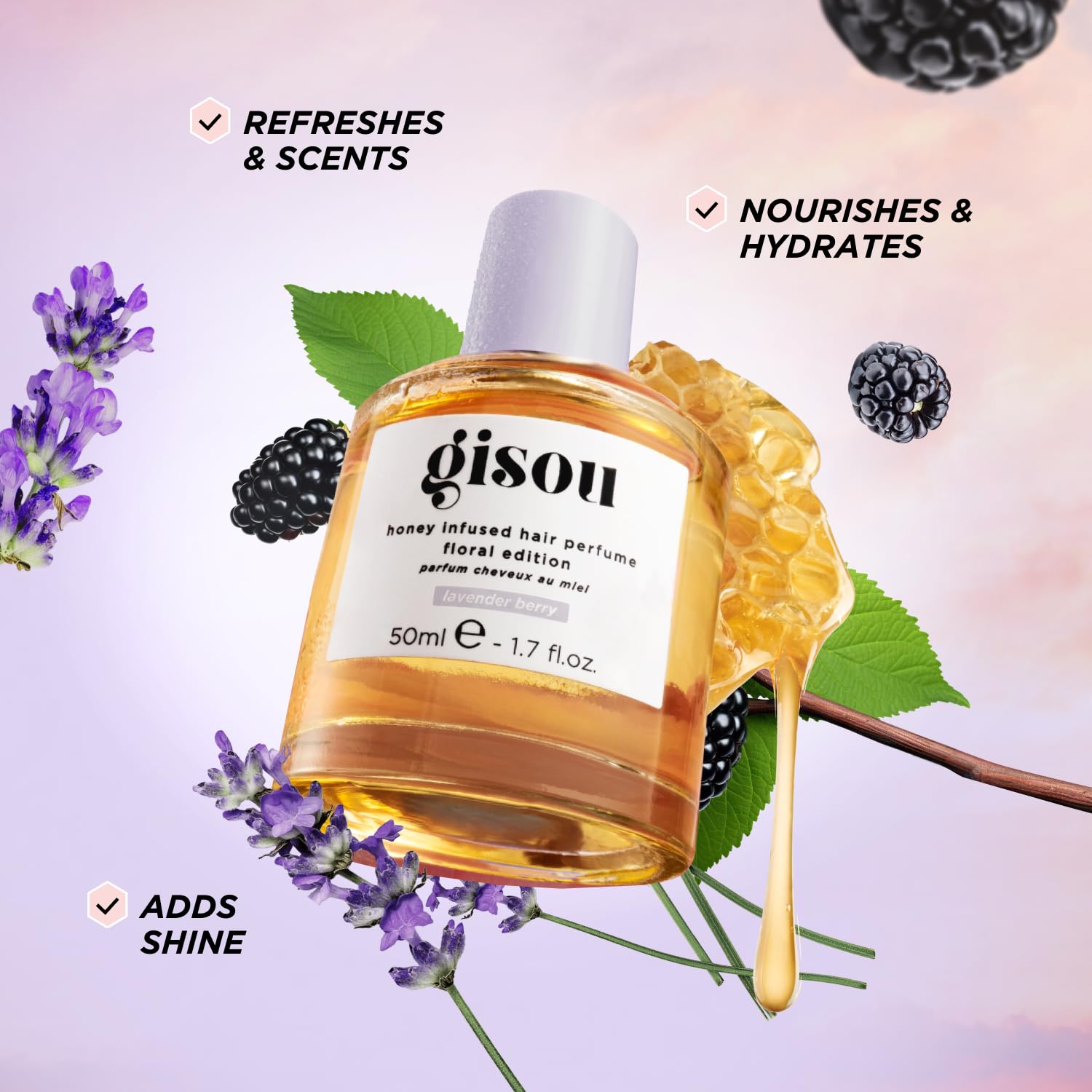 Gisou Honey Infused Hair Perfume Mini showcases argan oil for soft, silky hair.