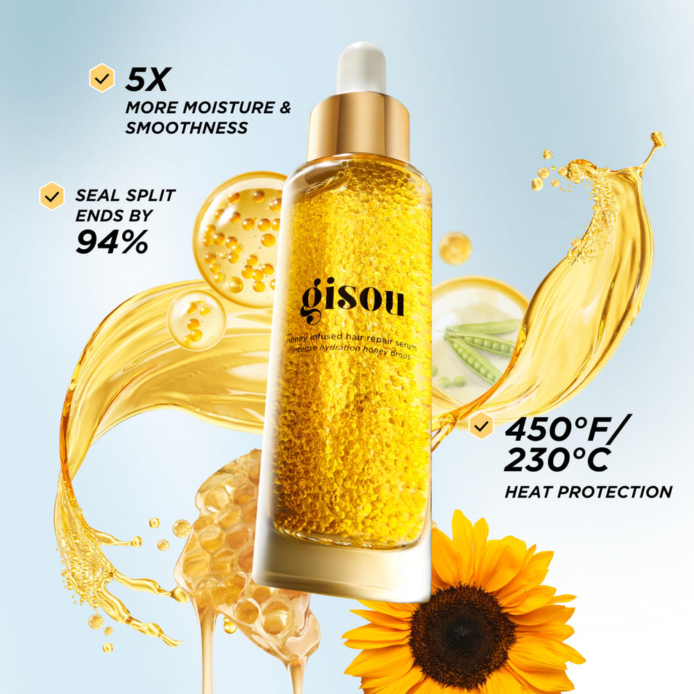 Gisou Honey Infused Hair Repair Serum dispenser in action for precise application.
