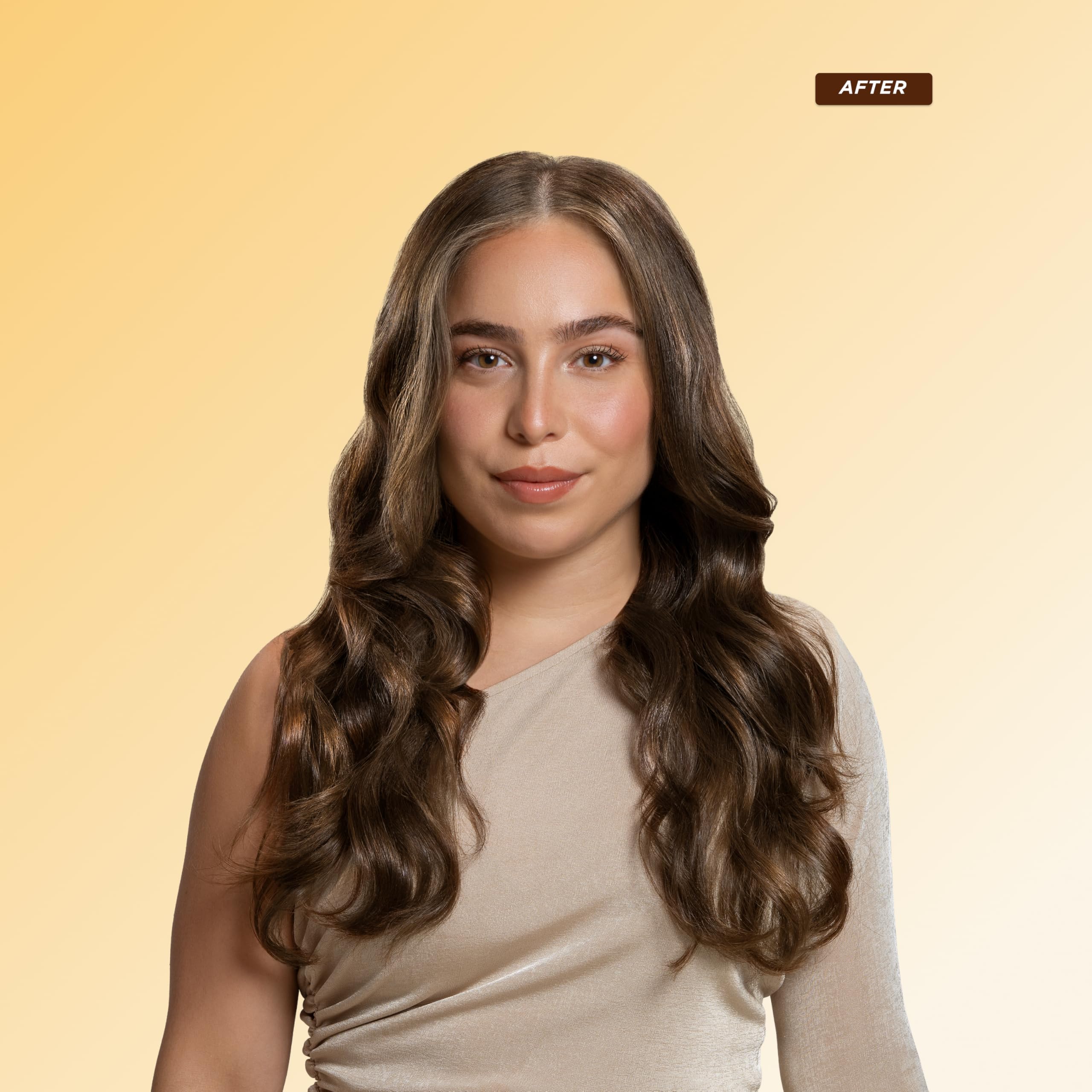 Gisou Honey Infused Hair Repair Serum demonstrates heat protection for styled hair.