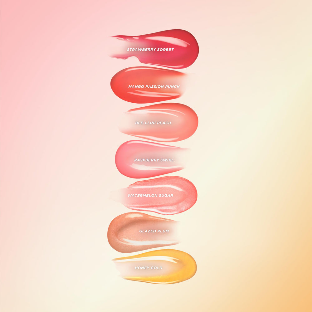 Gisou lip oil being applied for a subtle glow on the lips.