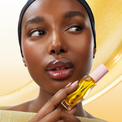 Gisou Honey Infused Lip Oil tube packaging highlighting compact 8ml design