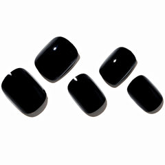 GLAMERMAID gothic black nails on finger with UV gloss for salon-quality finish