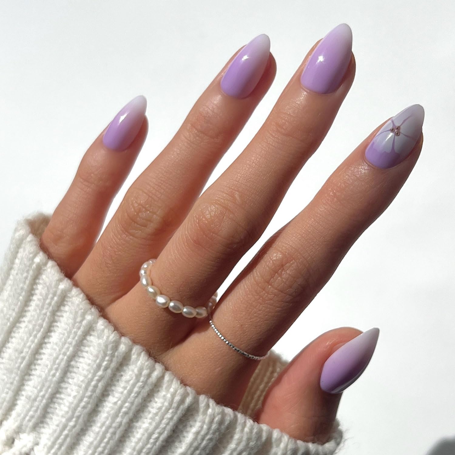 Glamnetic Lilac Reef nails close-up with floral accents for a tropical look