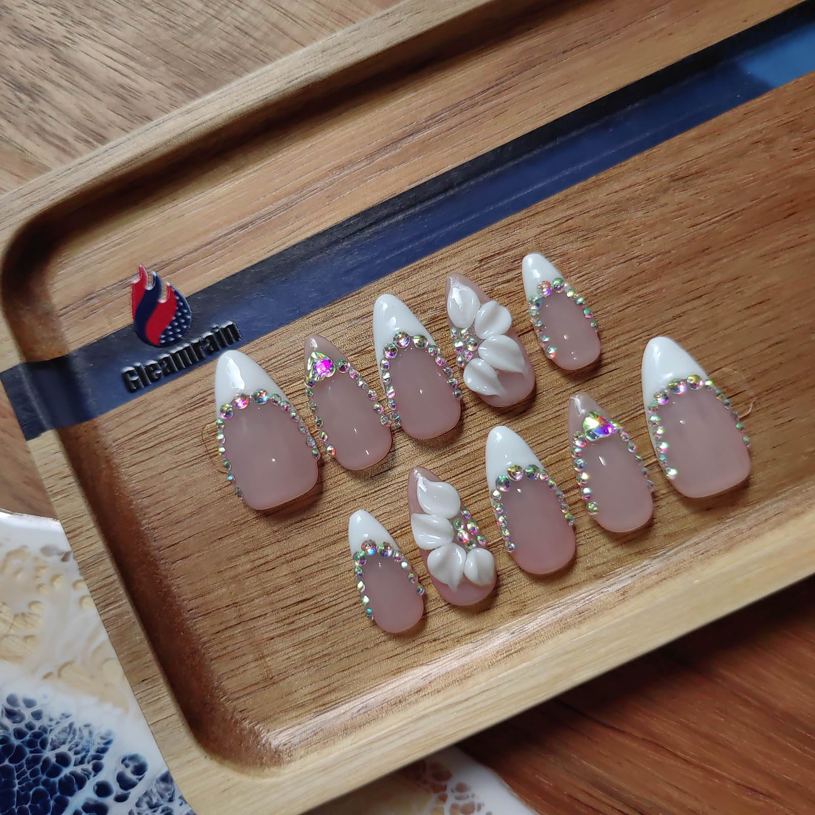 Gleamrain almond nails with soft color base for everyday elegance.