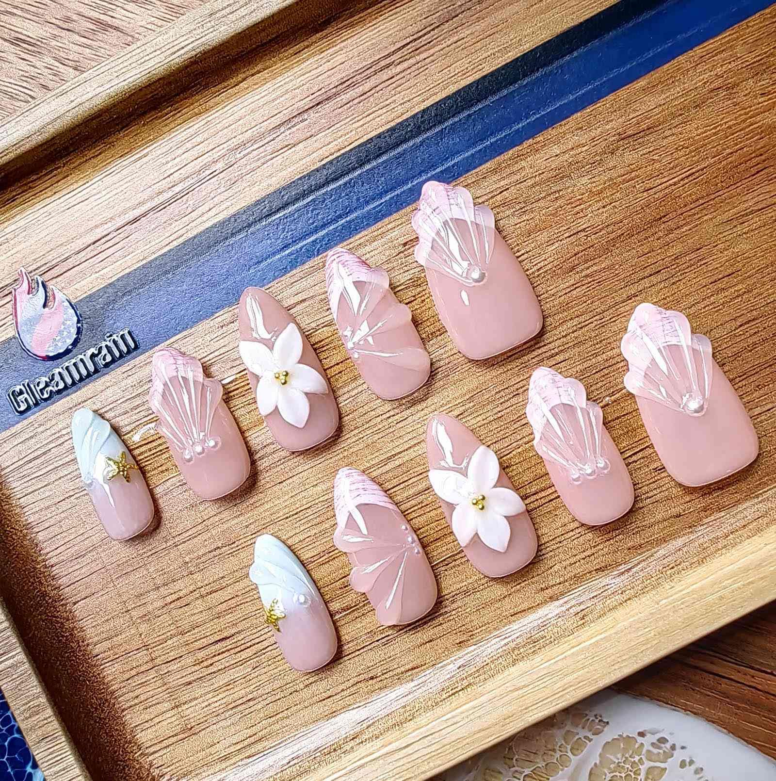 Gleamrain almond nails in neutral tones for everyday elegance.