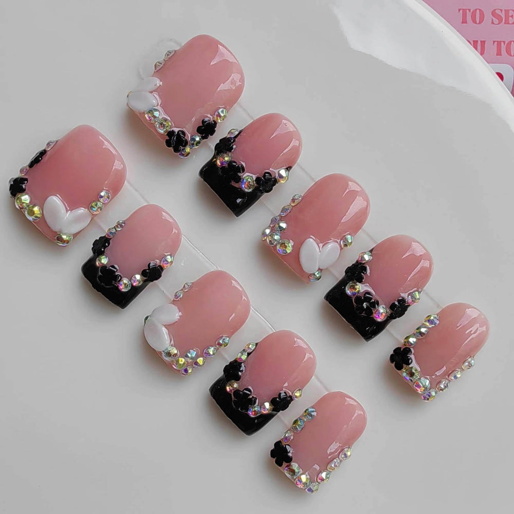 Gleamrain nails with nude base and white-black French tips for chic everyday wear