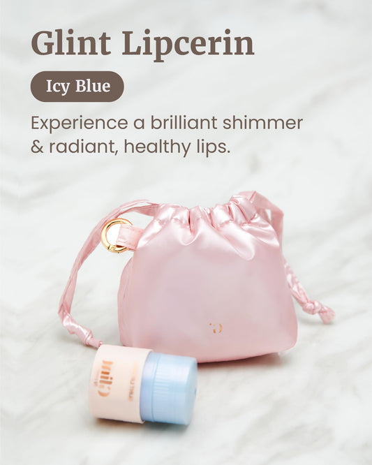 Glint Lipcerin icy blue tube close-up shows pearlescent shimmer