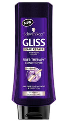GLISS Fiber Therapy conditioner bottle helps smooth fibers and detangle for softer, healthier-looking hair.