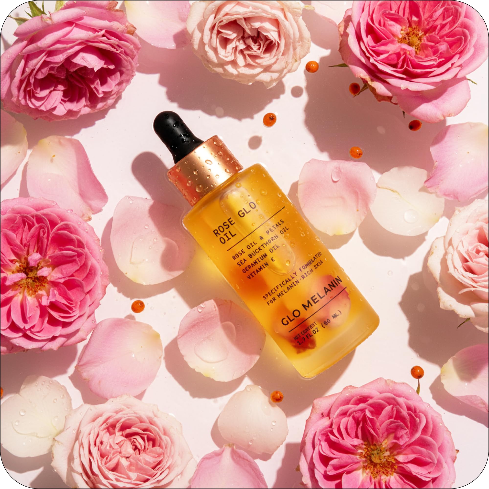 Glo Melanin Rose Glo Oil being applied to hands for moisture.