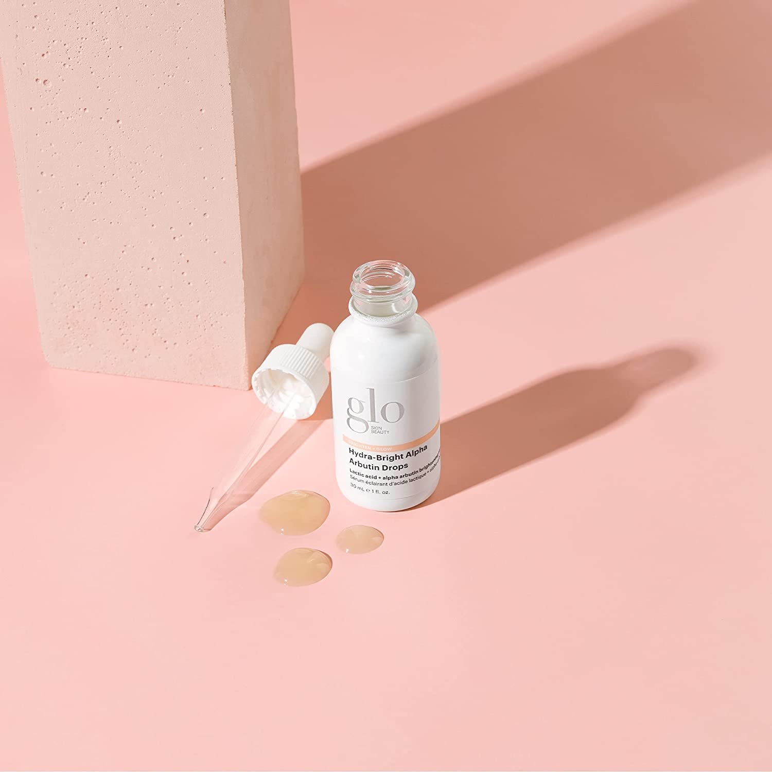 Glo Skin Beauty Hydra-Bright Alpha Arbutin Drops label close-up highlights clean, hydroquinone-free formulation.