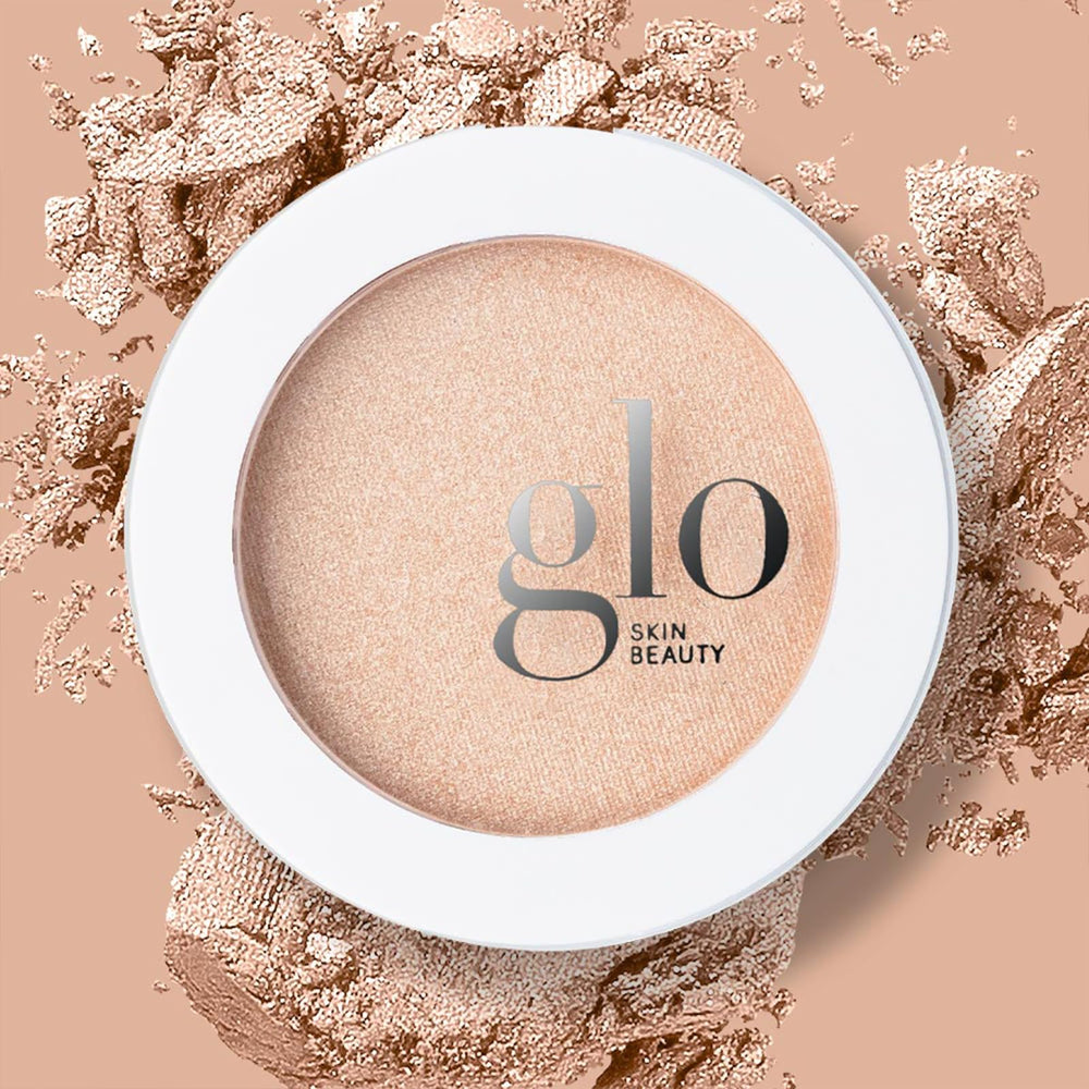 Glo Skin Beauty Skin Glow Powder Highlighter body glow under lighting.