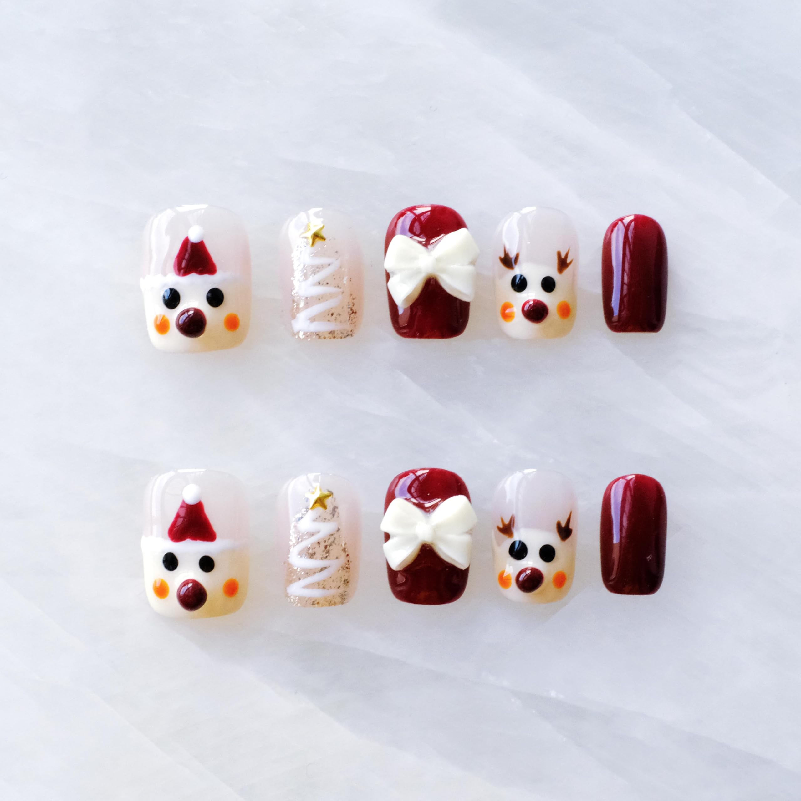 GLORS Christmas nails Santa bow design for a festive manicure at holiday parties.