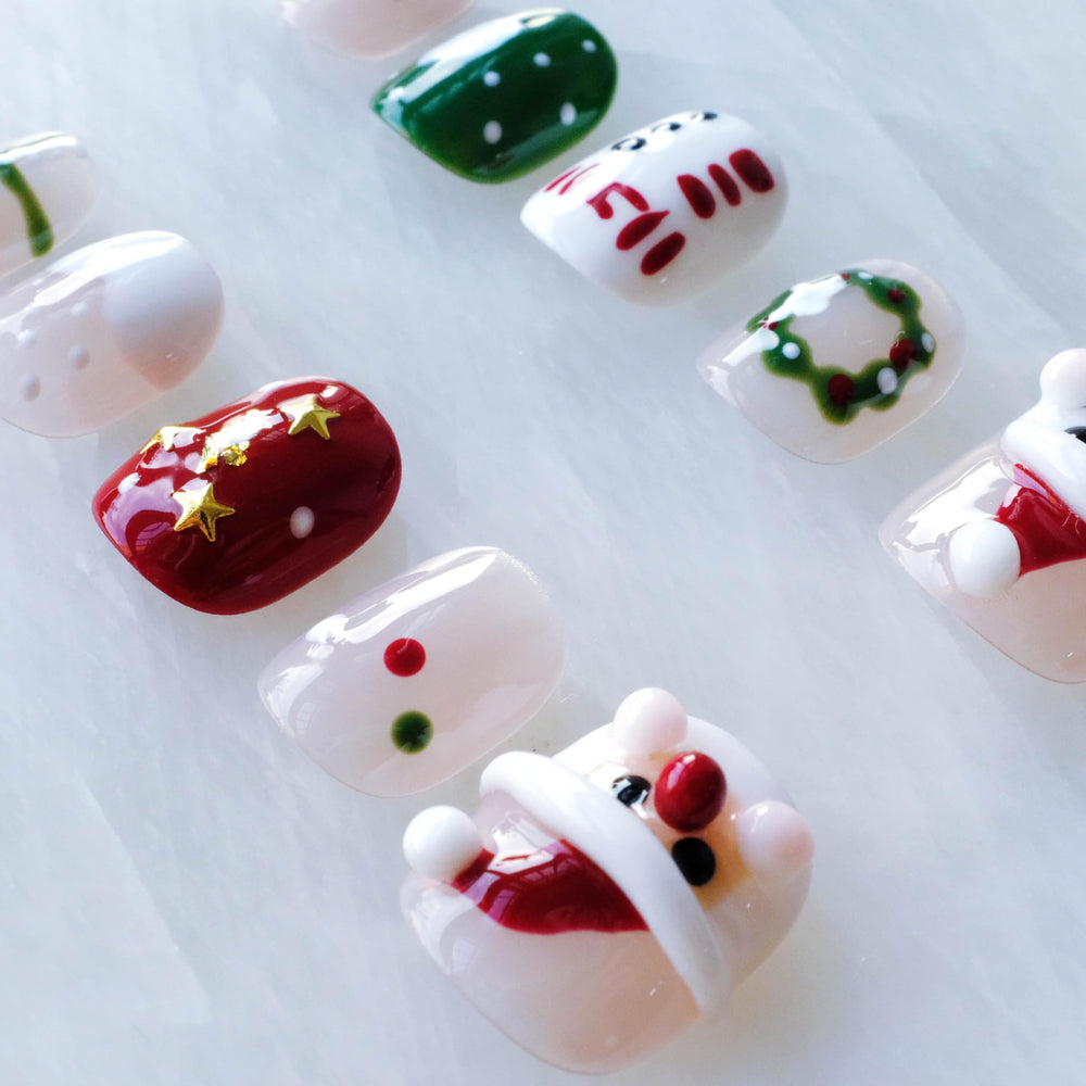 GLORS red and white backdrop nails for festive look.
