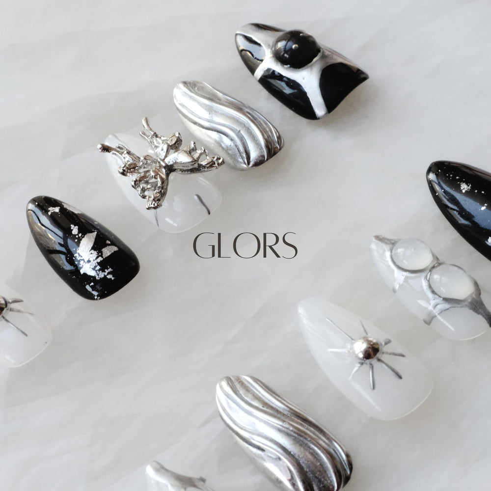 GLORS glossy black base nails provide a sleek versatile foundation.