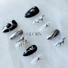 GLORS Gothic long almond nails with geometric designs for edgy chic style
