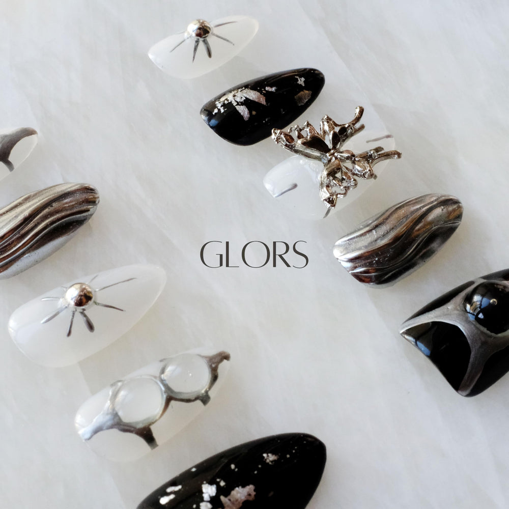 GLORS Gothic long almond nails showcasing starburst patterns for high-impact detail
