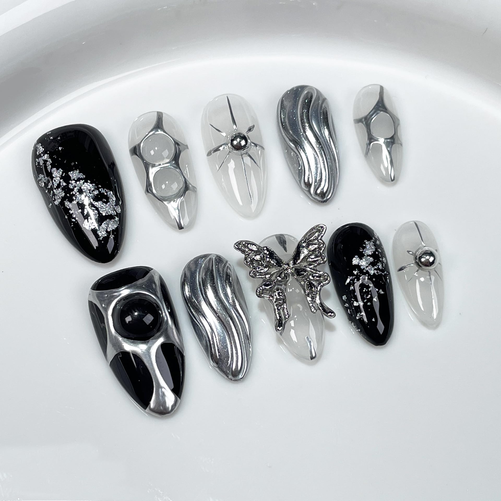 GLORS Gothic long almond press-on nails with black and silver butterfly accent for dramatic style.