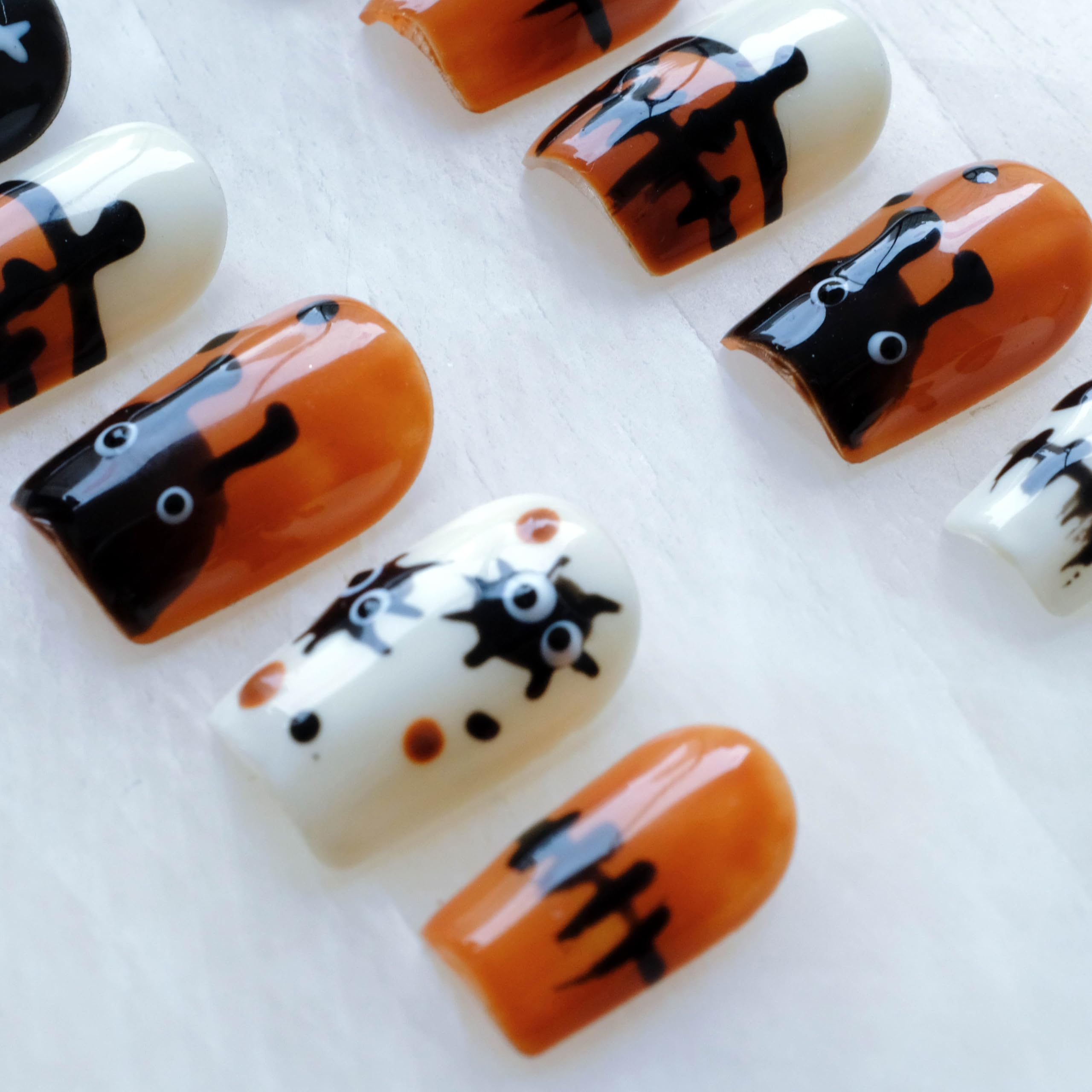 GLORS orange-black-white patterns for eye-catching manicure