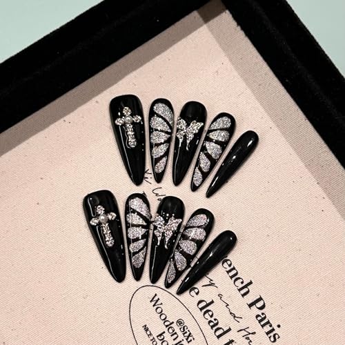 Handmade GLORS nails with butterfly design and metallic accents for dramatic gothic look