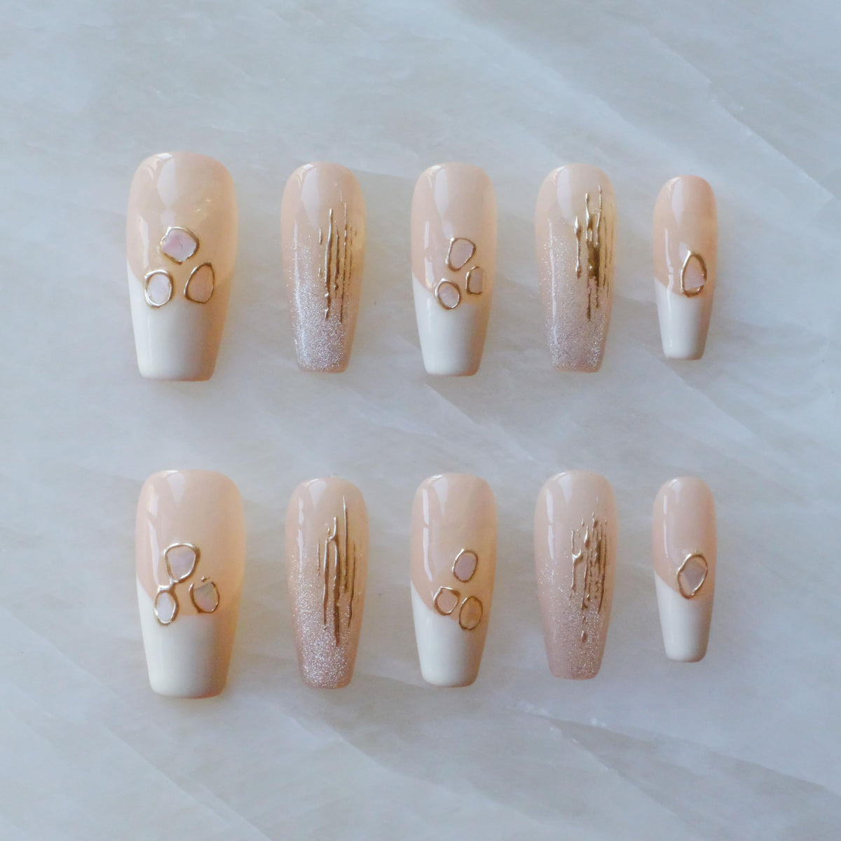 GLORS nails with pink-white gradient and shell accents for an elegant, salon-ready at-home wear