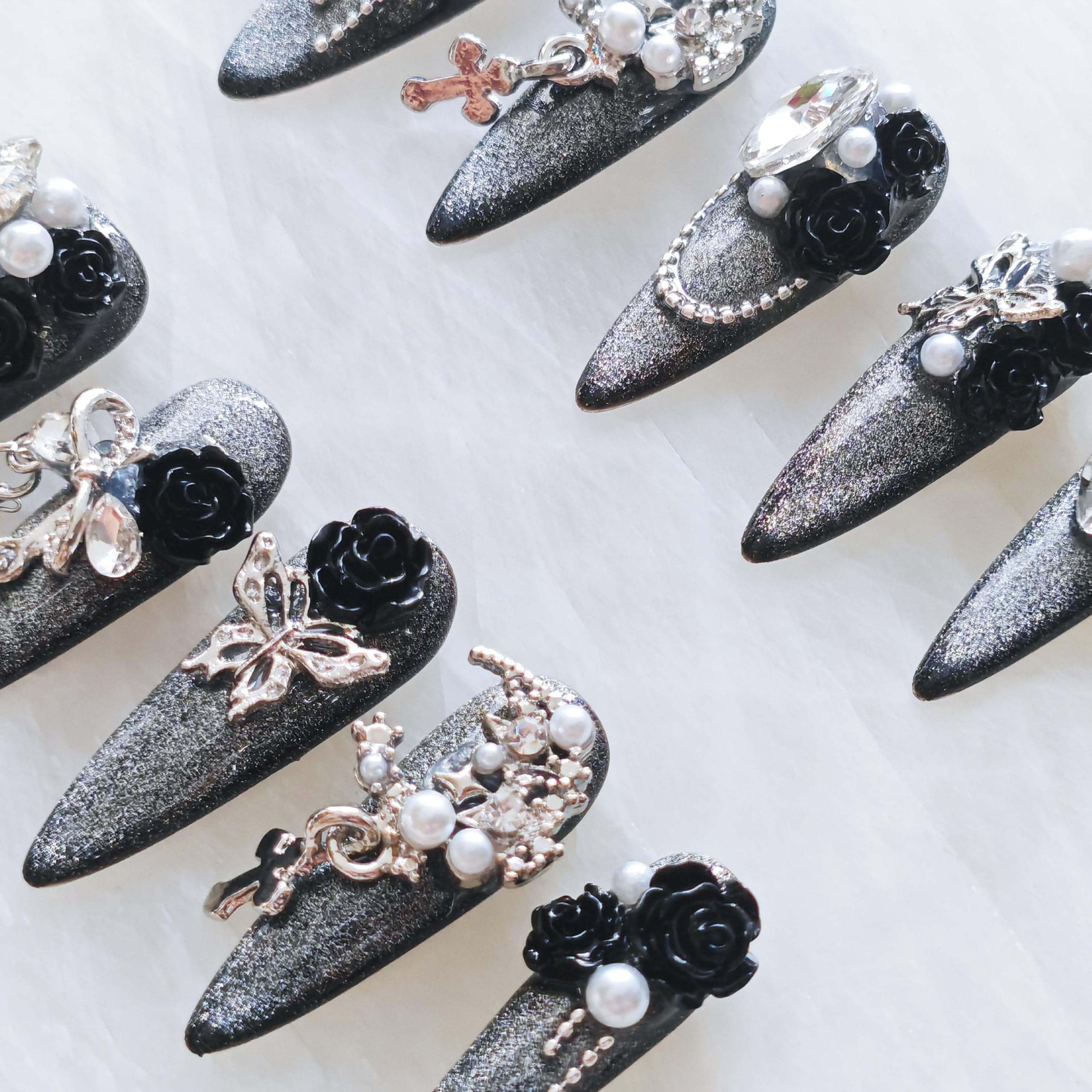 Photoshoot-ready GLORS nails enhancing dark romantic styling.
