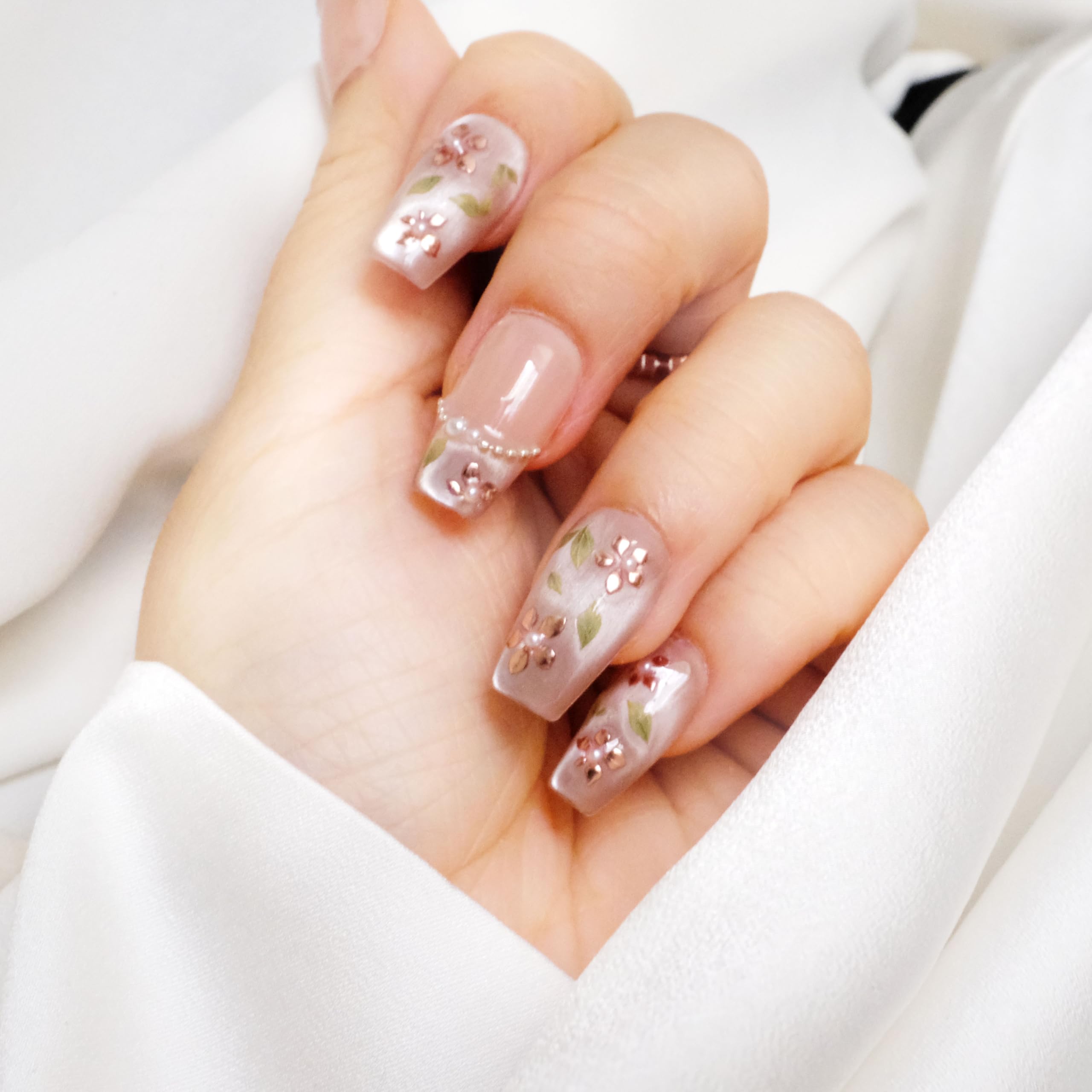 GLORS medium ballerina nails in nude pink with rose gold foil and pearls