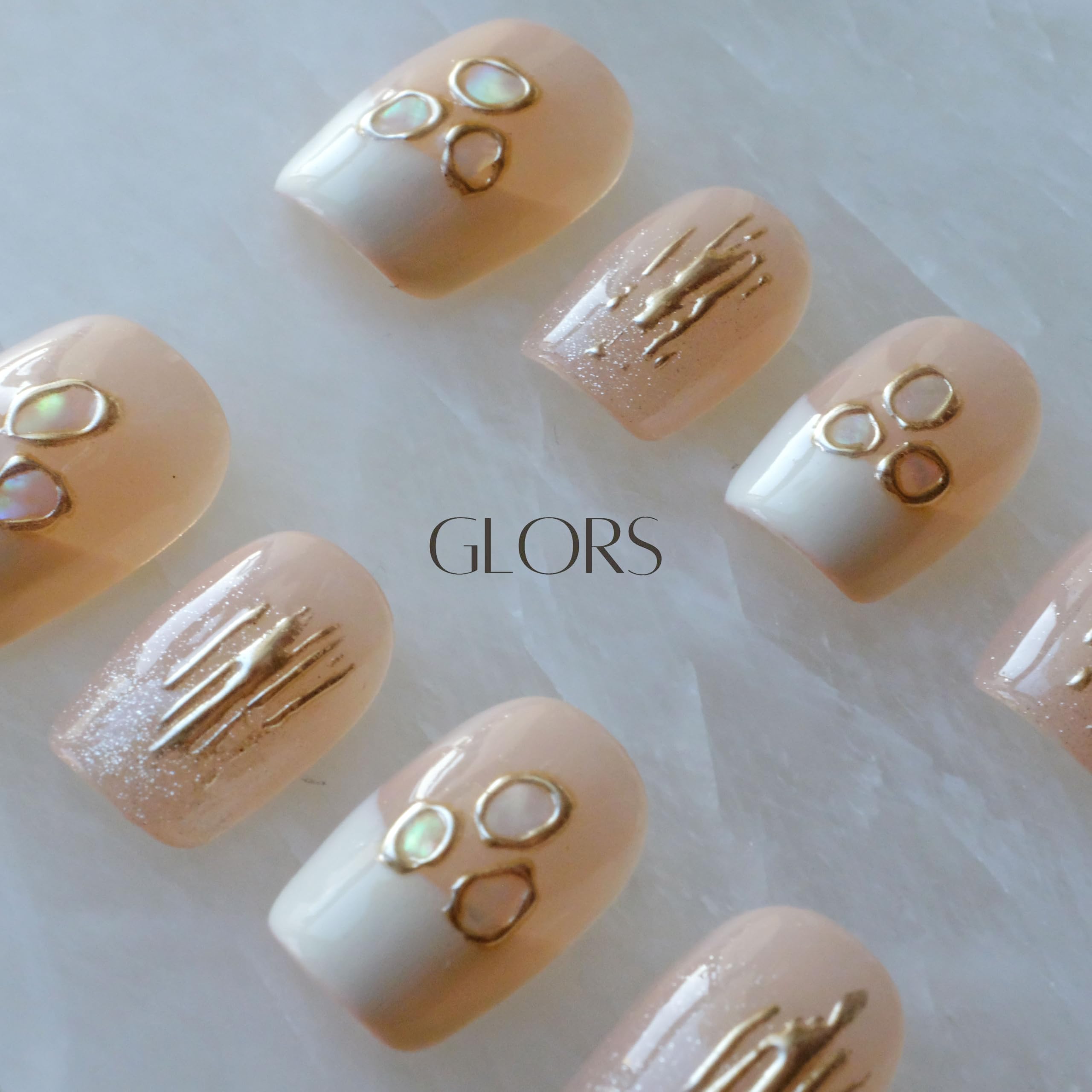 GLORS Mica Love shell-piece detail highlights intricate pattern and reflective surface