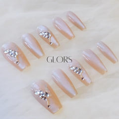 Butterfly rhinestone accents on GLORS nails add subtle sparkle for special occasions