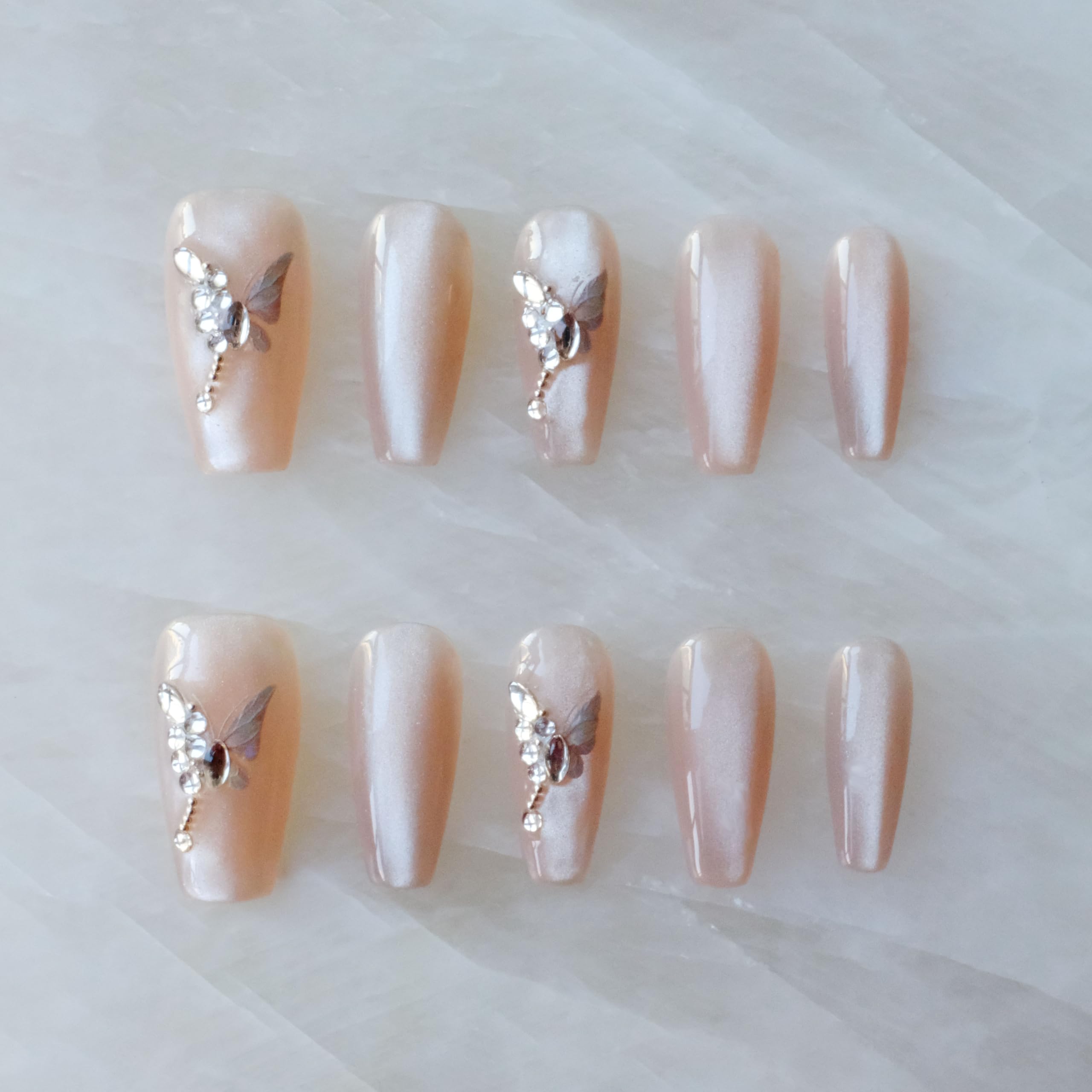 GLORS press-on nails in long nude pink ballerina coffin shape for instant elegance.