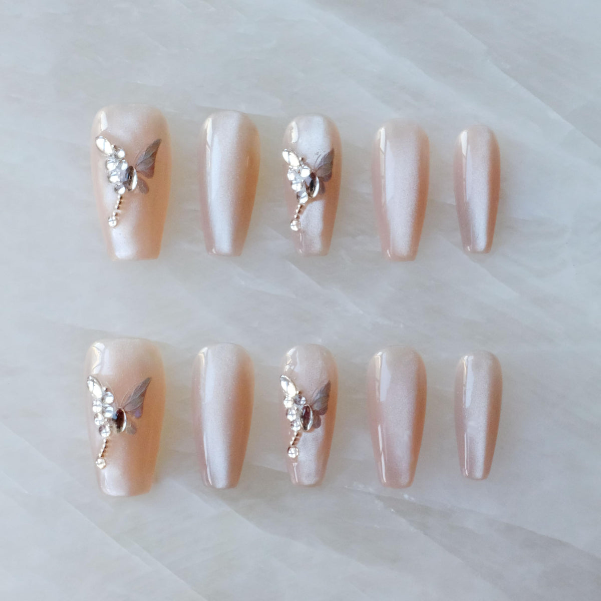 GLORS press-on nails in long nude pink ballerina coffin shape for instant elegance.