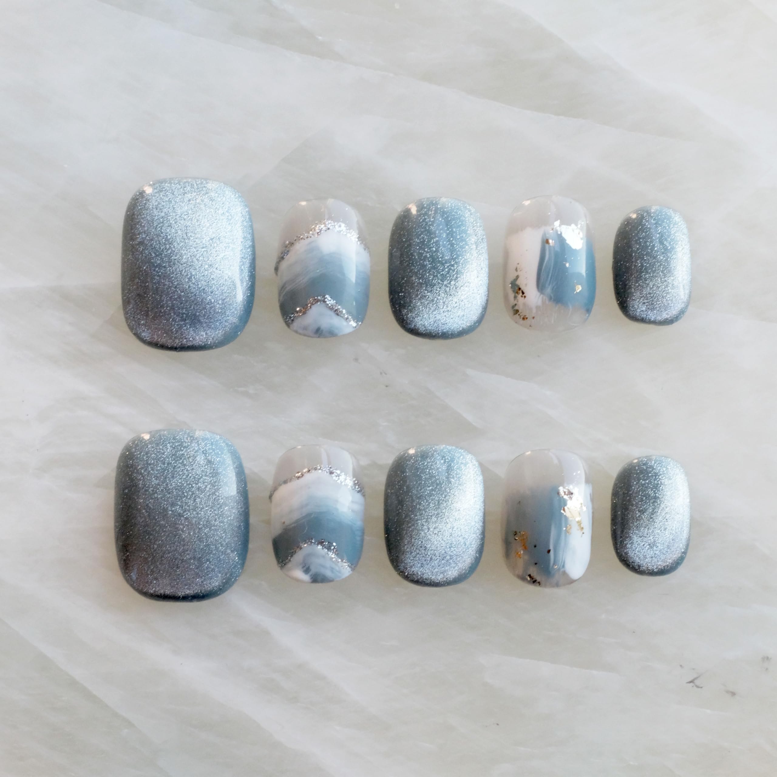GLORS Purely Handmade Nails with blue and white glitter snow mountain design for festive daily wear.