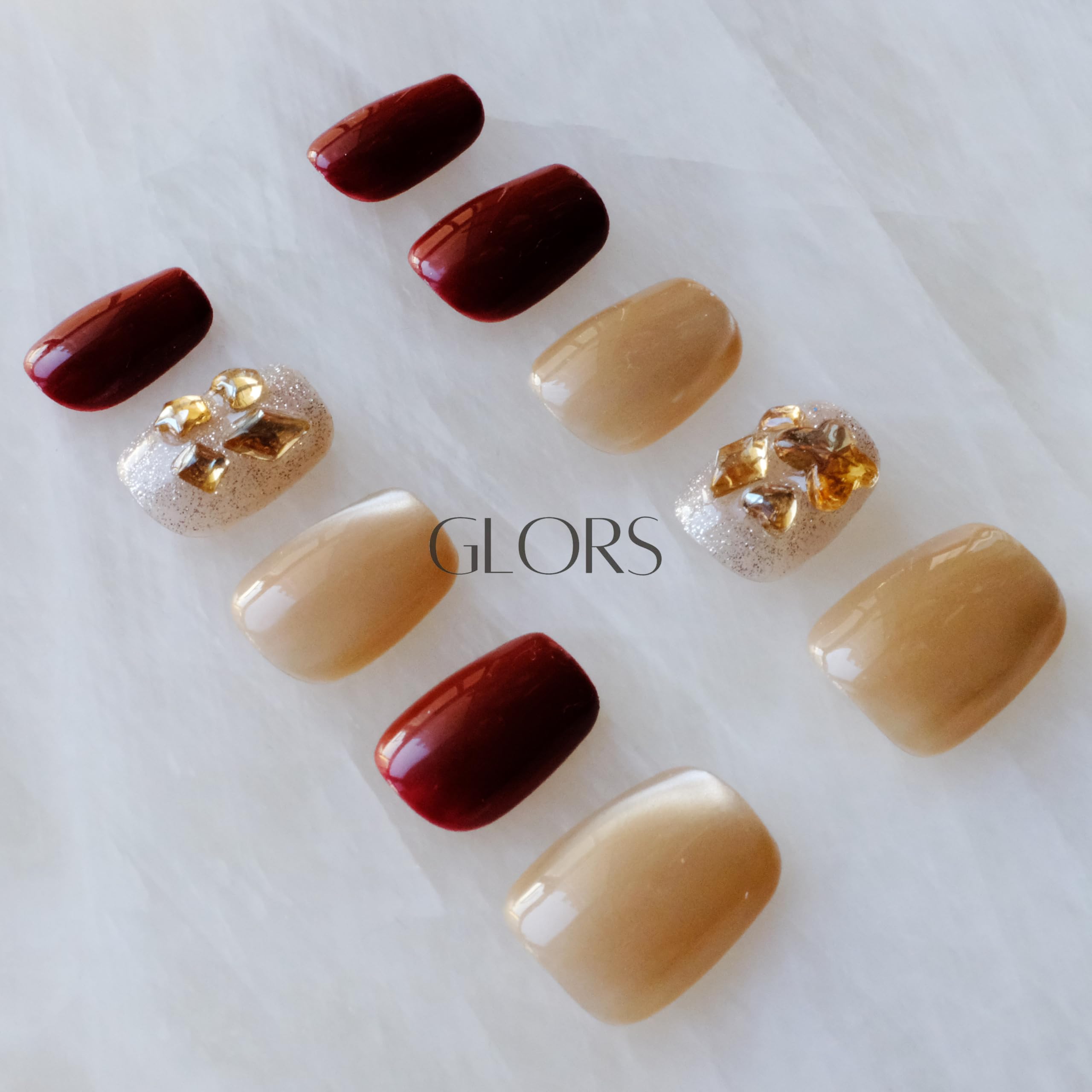 GLORS Intricate detailing and premium finish on burgundy cat-eye nails