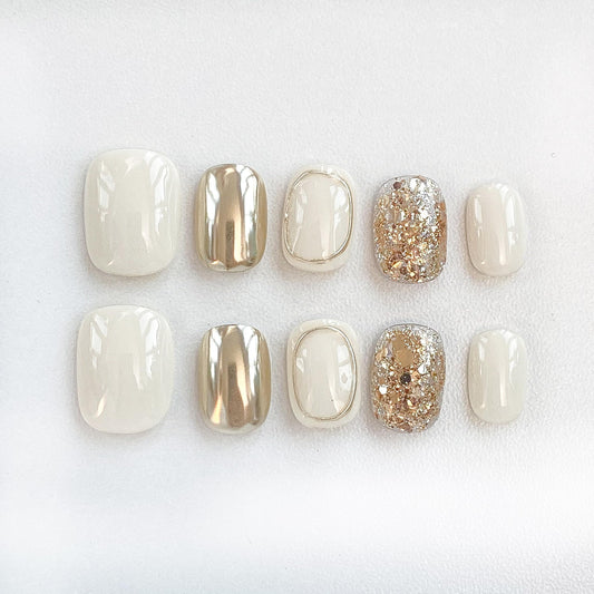 GLORS Purely Handmade nails in beige and gold glitter for elegant daily wear.
