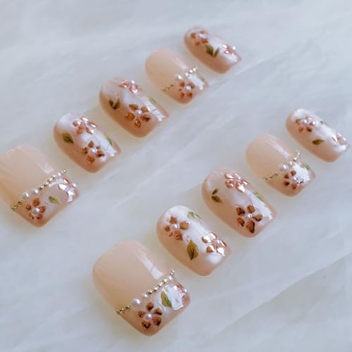 GLORS rose gold foil detail on nails with pearl accents close-up