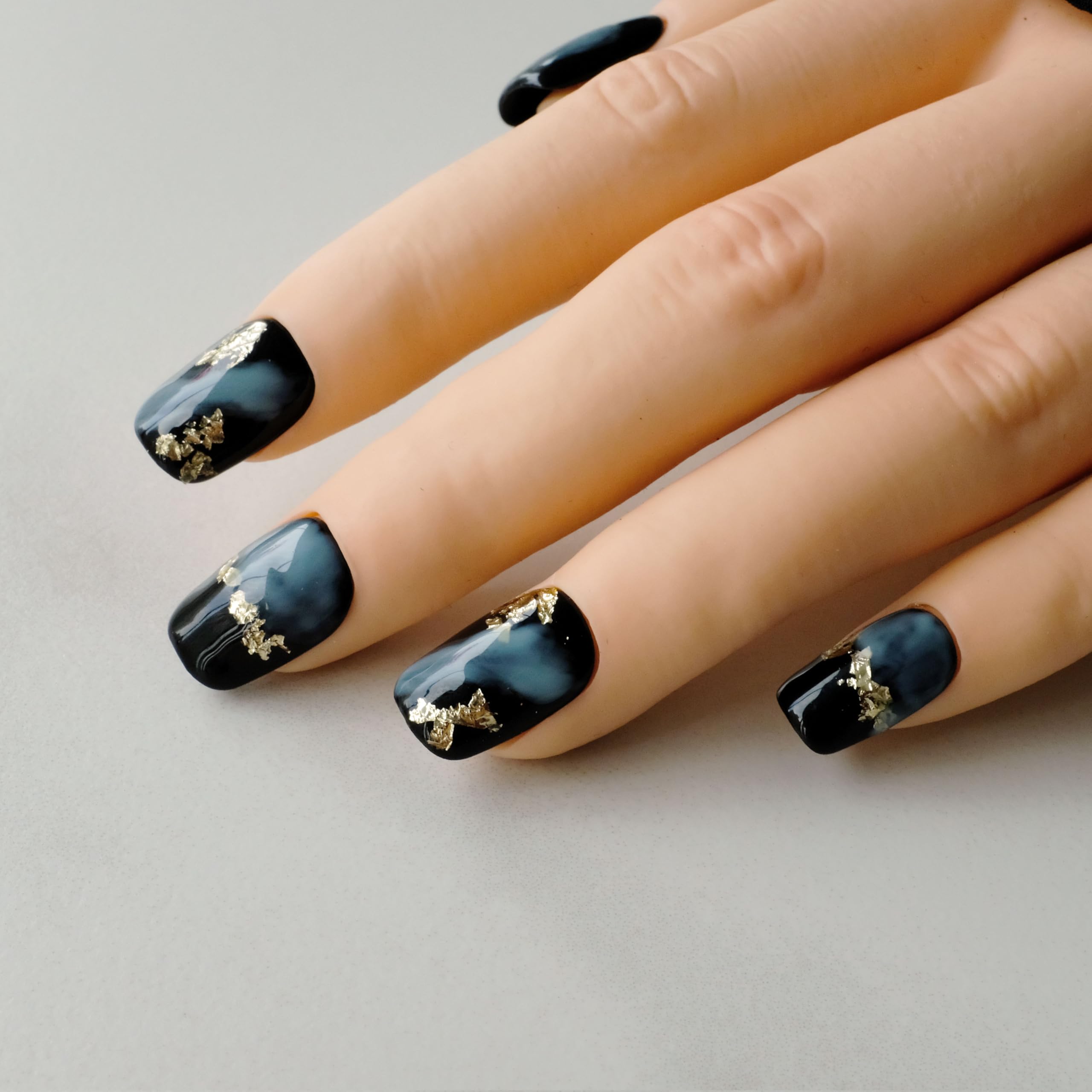 GLORS short square tips for everyday wear with bold black-blue marble and gold accents