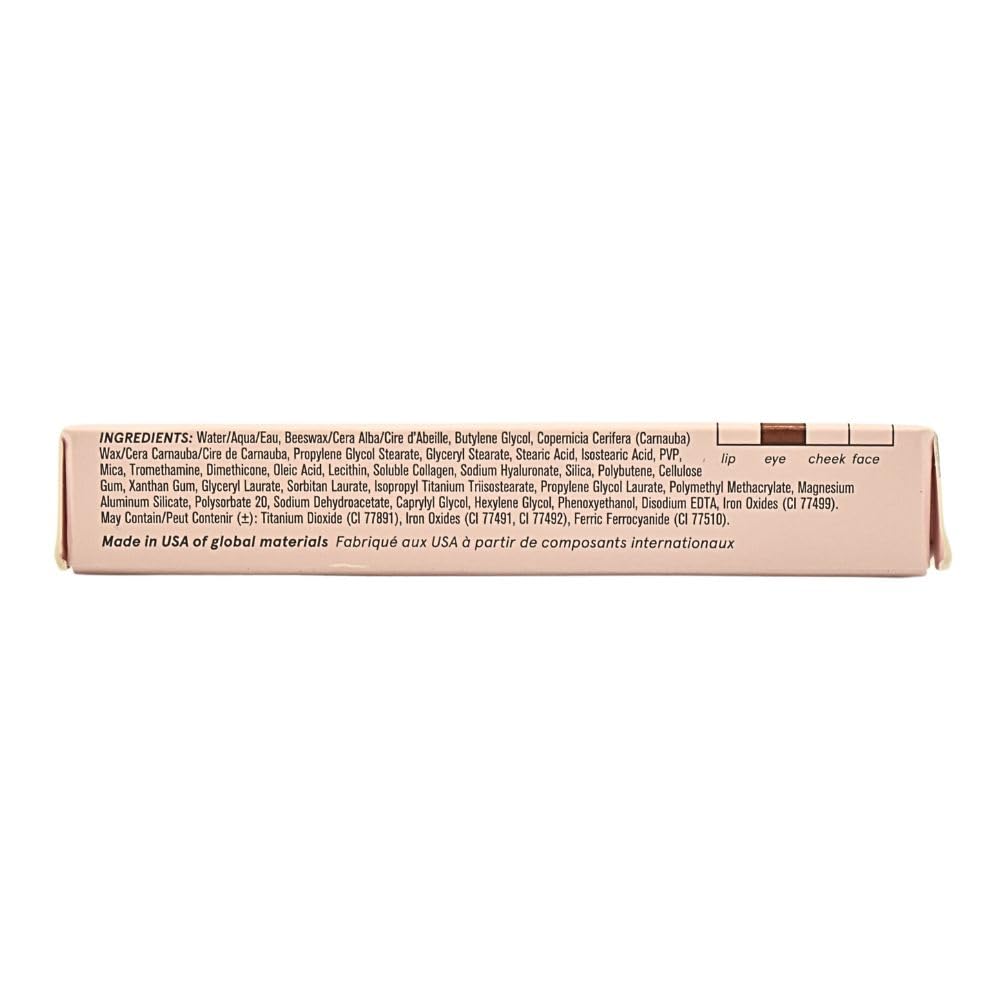 Glossier Boy Brow Auburn nourishing formula visible on brow hairs.