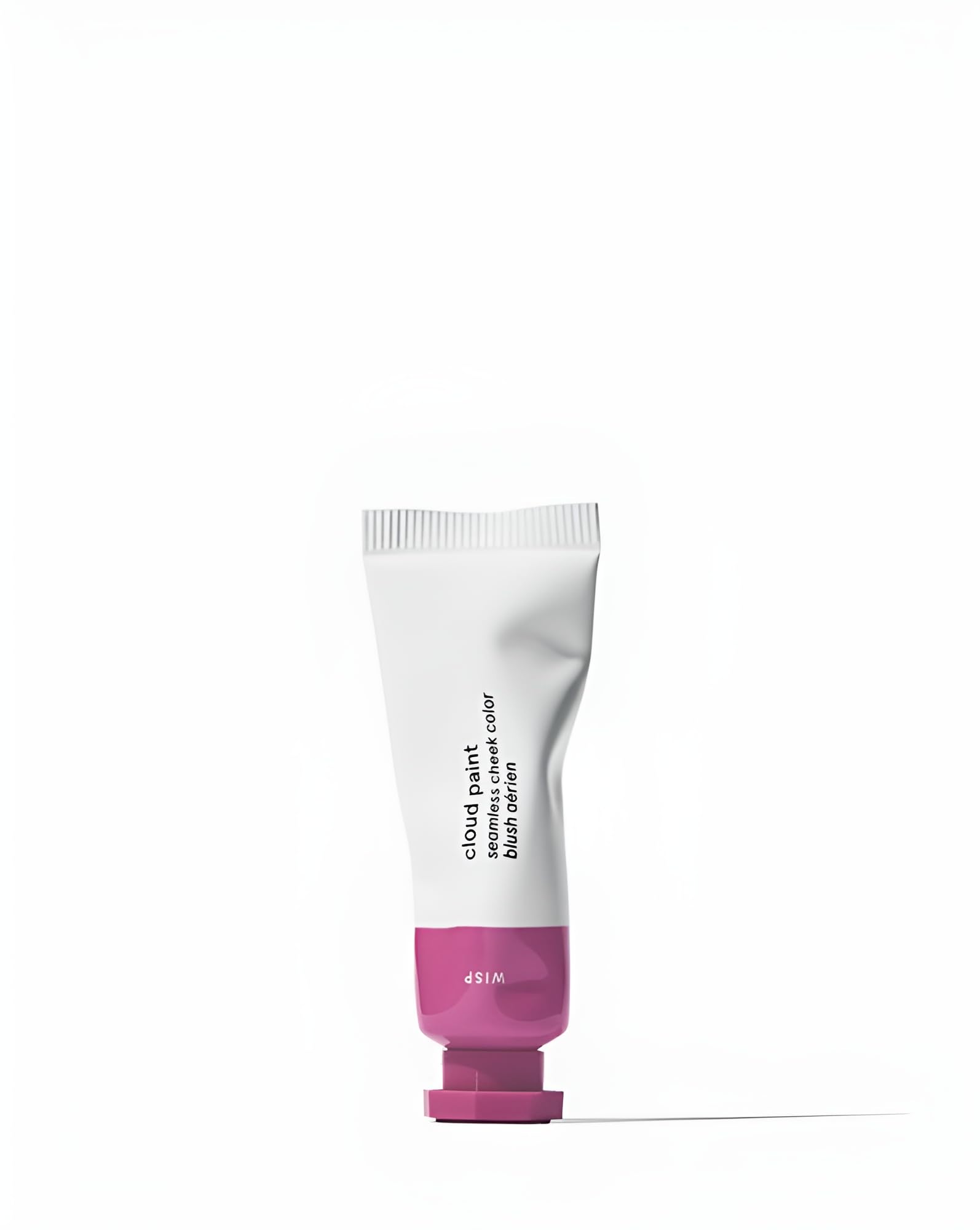 Glossier Cloud Paint Wisp swatch on skin shows a natural, buildable lilac glow