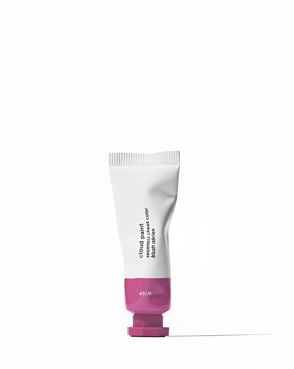 Glossier Cloud Paint Wisp swatch on skin shows a natural, buildable lilac glow