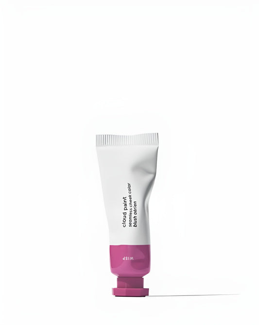 Glossier Cloud Paint Wisp swatch on skin shows a natural, buildable lilac glow
