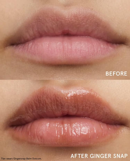 Glossier Balm Dotcom Gingersnap applied directly to lips for targeted relief.
