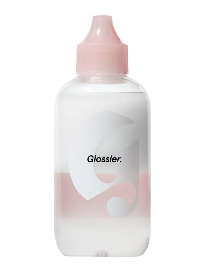 Glossier Milky Oil dual-phase remover bottle dispensing for easy makeup removal